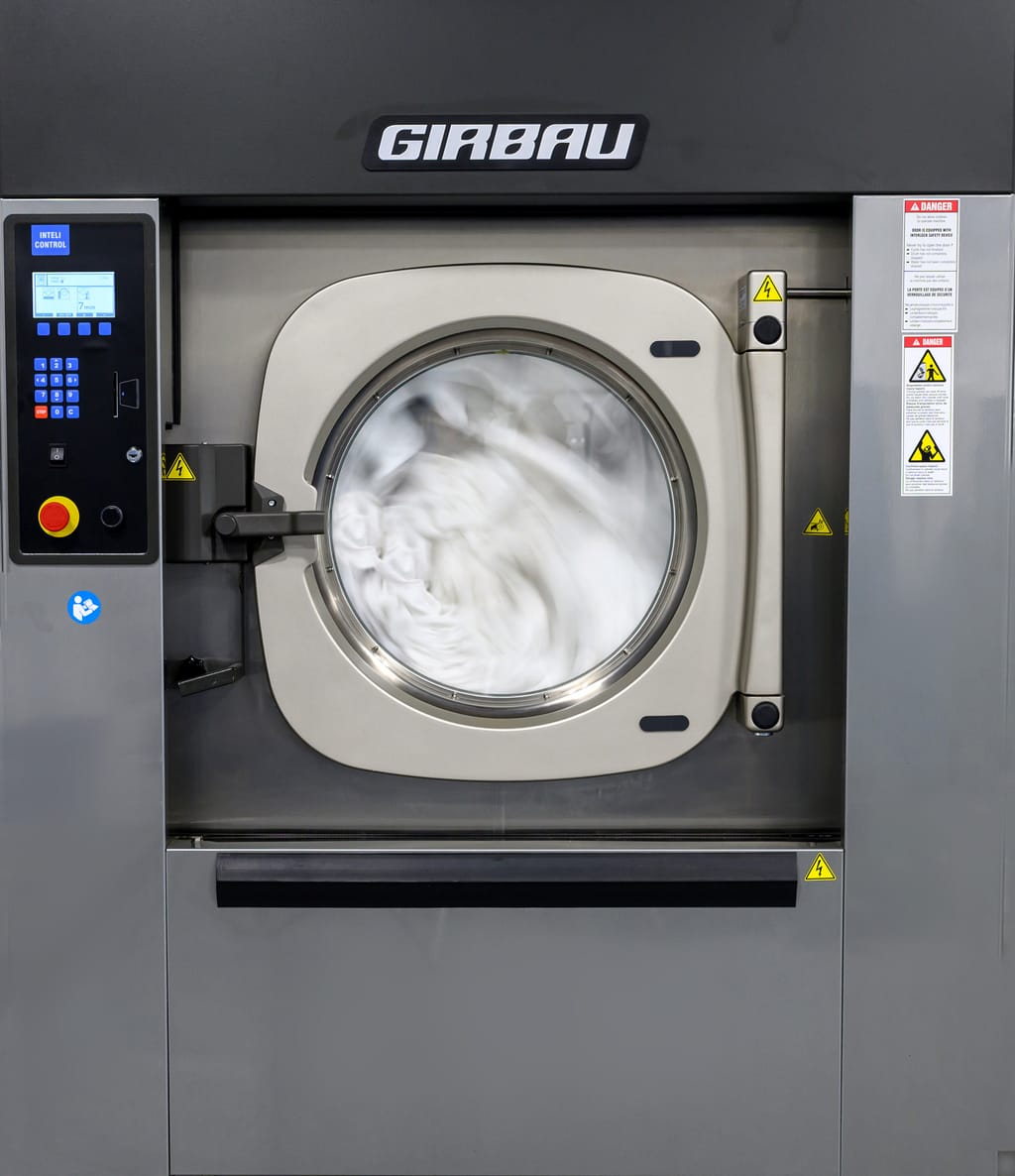 Girbau commercial washer processing healthcare linens at Blue River Laundry