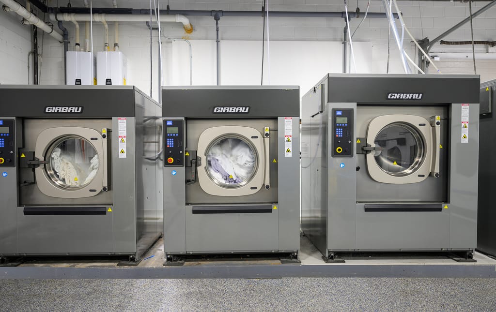 Brand-new Girbau commercial washers at the Blue River Laundry facility in Endicott, NY